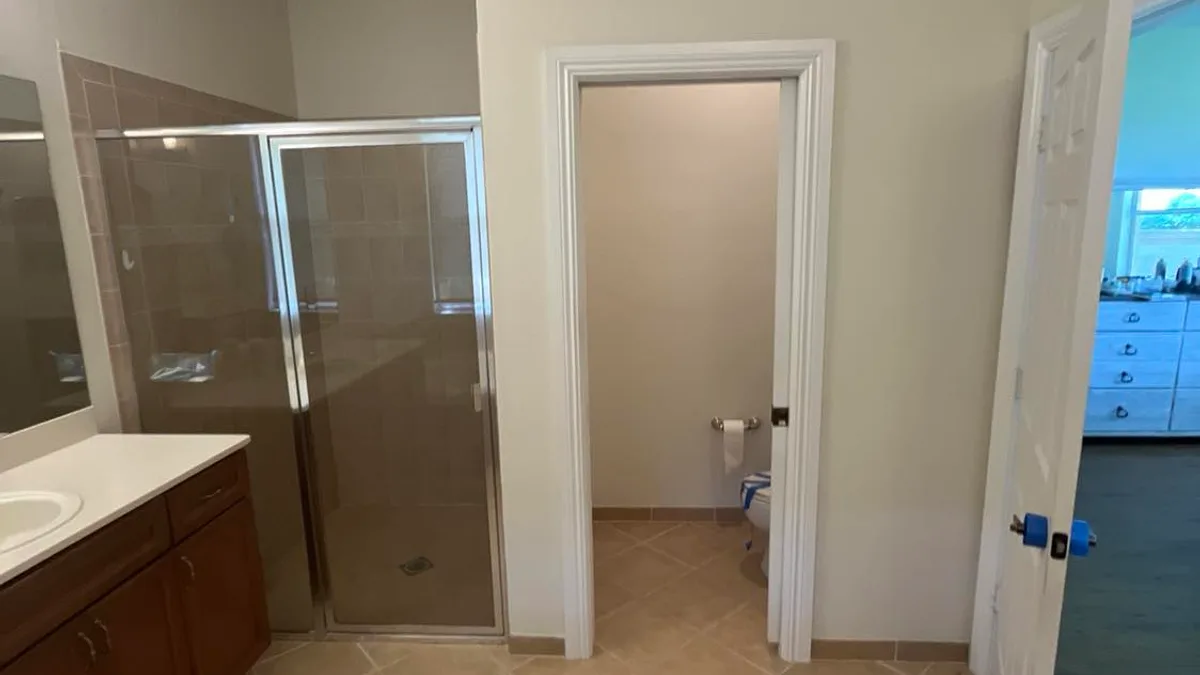 Painted bathroom walls, trim, and shower enclosure